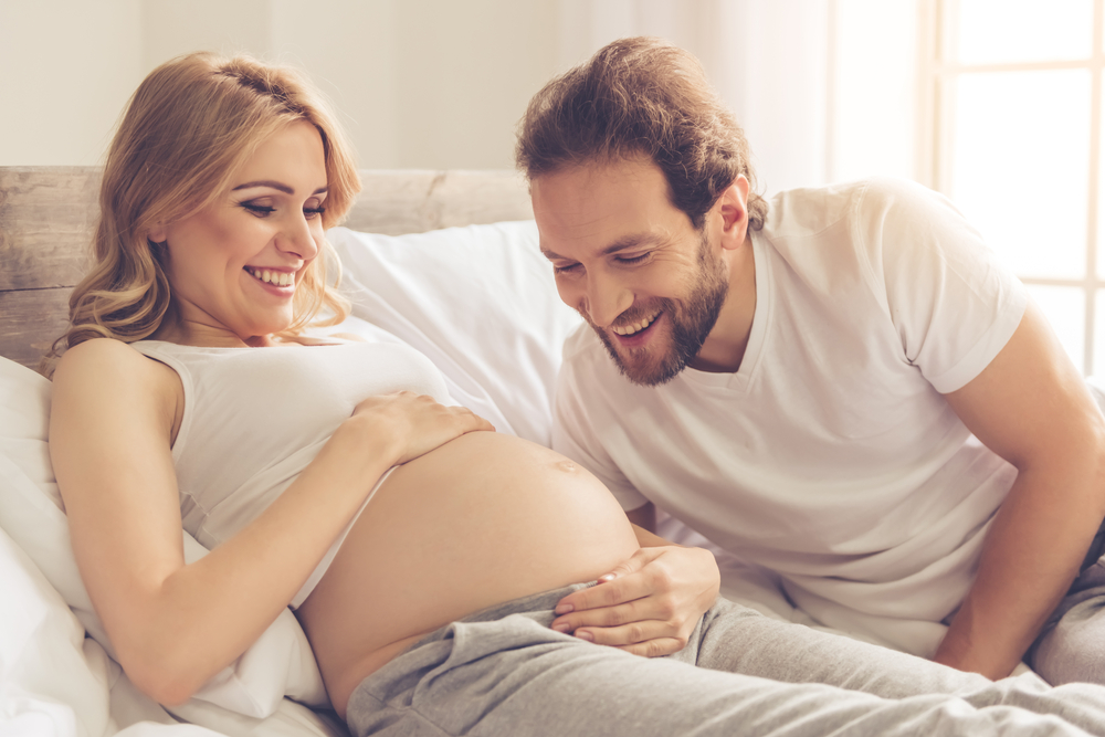 Beautiful,Pregnant,Woman,And,Her,Handsome,Husband,Are,Smiling,While