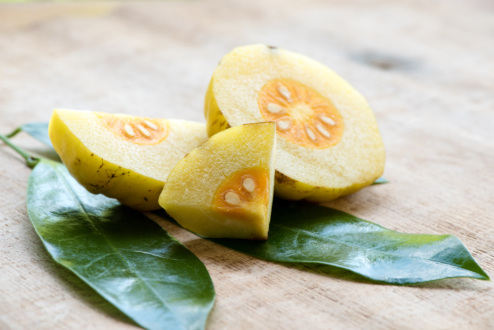 Garcinia,Cambogia,,Fruits,On,Old,Wood,Background.