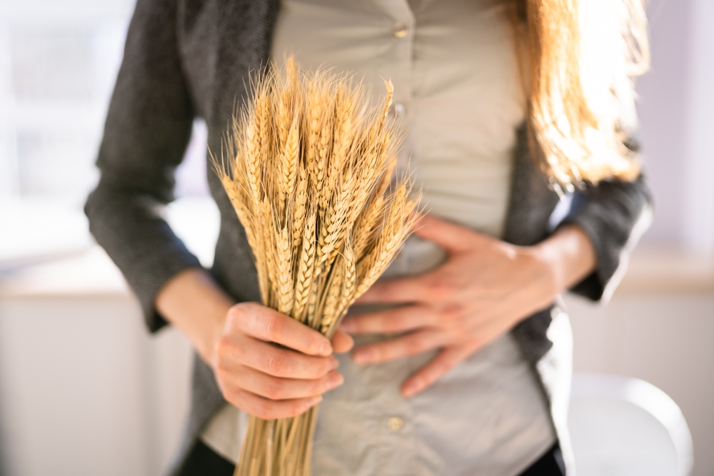 Celiac,Disease,And,Gluten,Intolerance.,Women,Holding,Spikelet,Of,Wheat