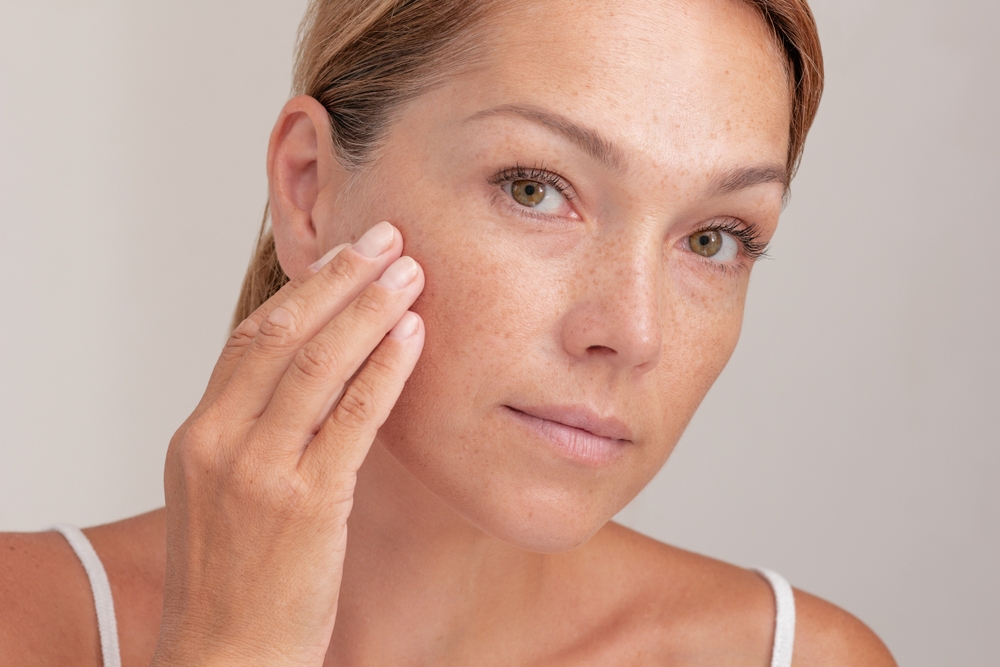 Portrait,Of,Cropped,Caucasian,Middle,Aged,Woman,Face,With,Freckles