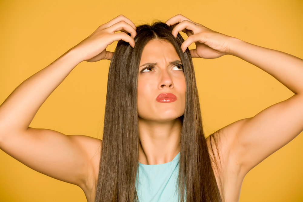 Beautiful,Young,Woman,With,Itchy,Scalp,On,Yellow,Background