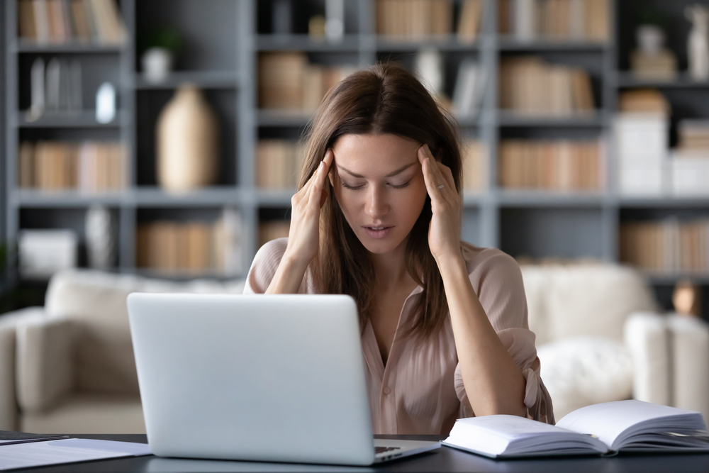 Tired,Woman,Massaging,Temples,,Suffering,From,Headache,After,Computer,Work,