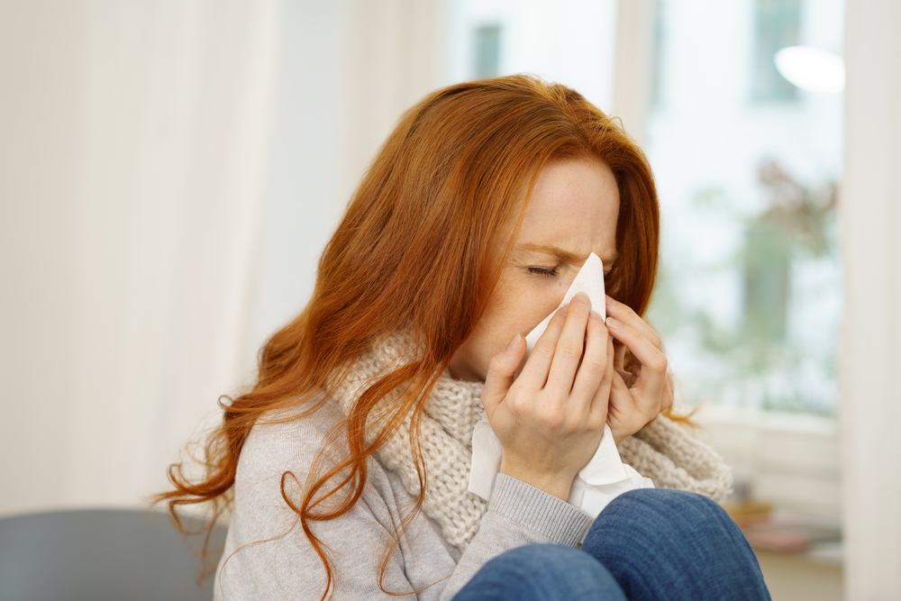 Sick,Young,Woman,With,Seasonal,Influenza,Blowing,Her,Nose,On