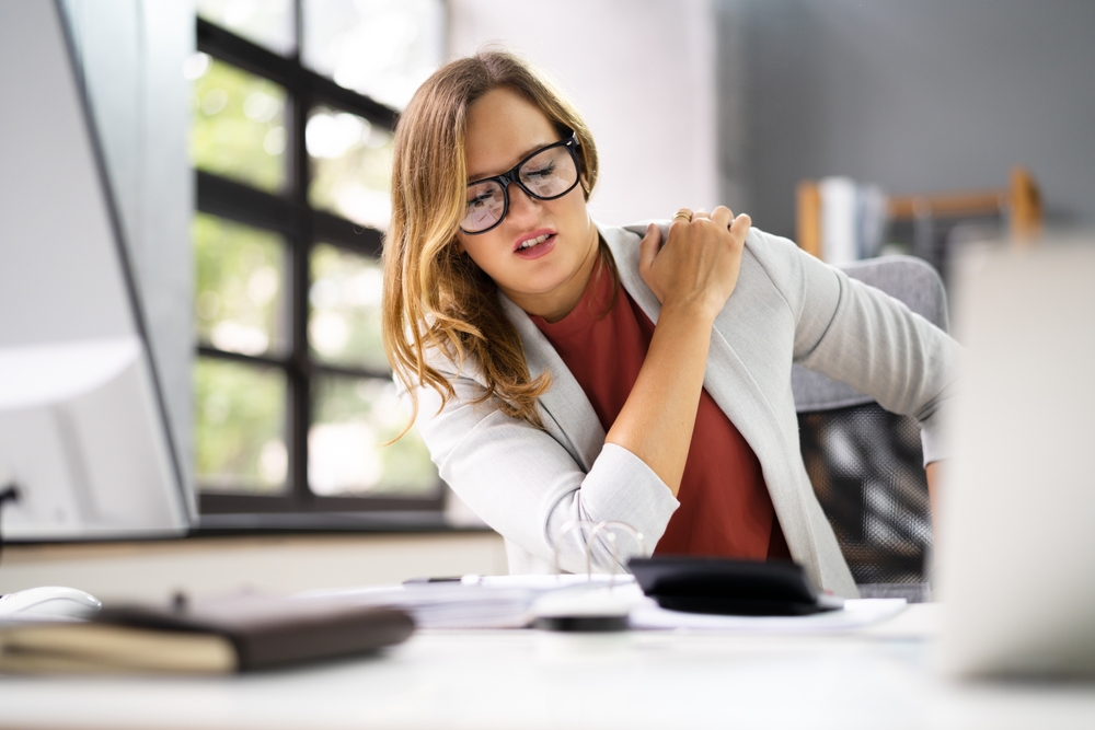 Shoulder,Pain,Bad,Posture,Woman,Sitting,In,Office