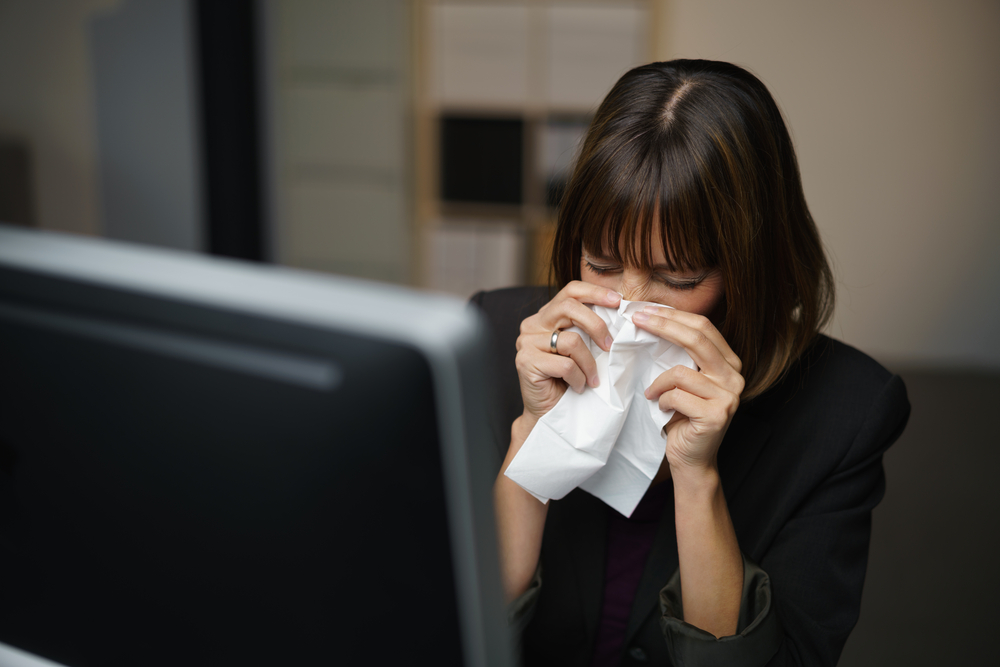 Businesswoman,With,A,Seasonal,Winter,Fever,And,Chill,Blowing,Her