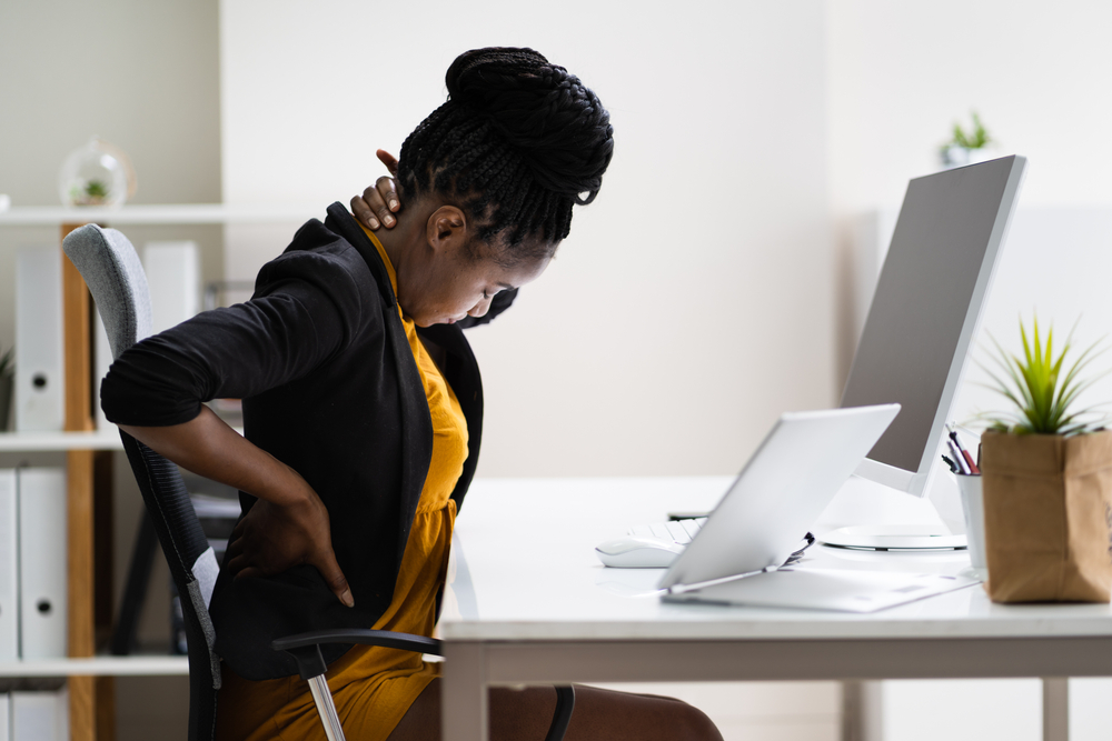 Back,Pain,Bad,Posture,Woman,Sitting,In,Office