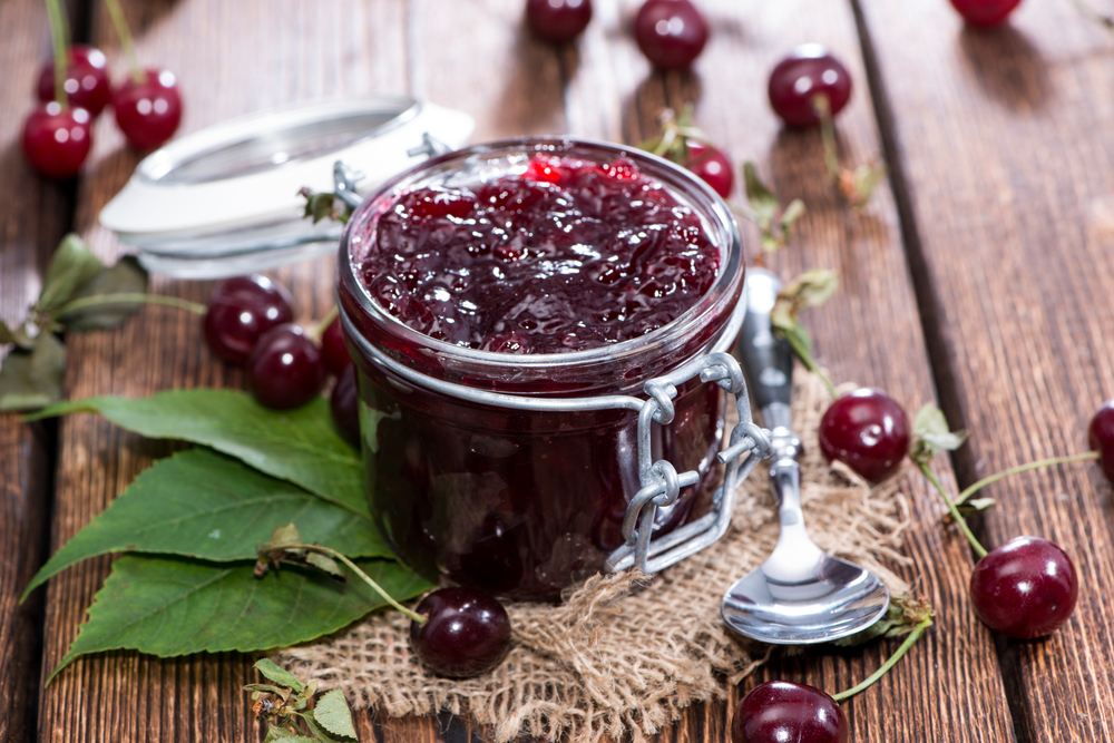 Glass,With,Homemade,Cherry,Jam,On,Wooden,Background